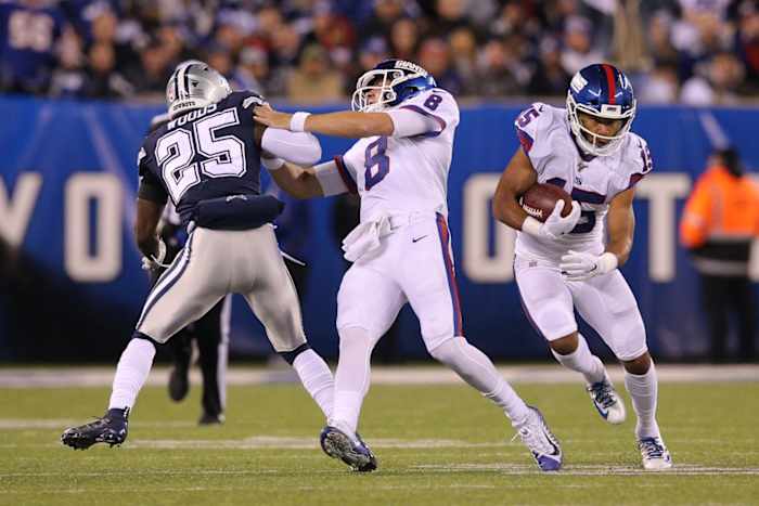Nov 4, 2019; East Rutherford, NJ, USA; New York Giants quarterback Daniel Jones (8) blocks Dallas Cowboys safety Xavier Woods (25) as New York Giants wide receiver Golden Tate (15) runs the ball during the second quarter at MetLife Stadium.